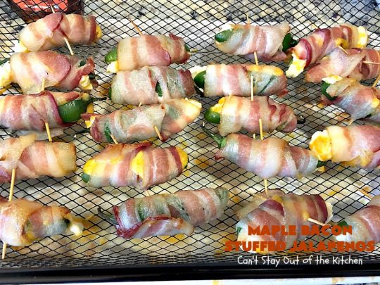 Maple Bacon Stuffed Jalapenos | Can't Stay Out of the Kitchen | this spectacular #appetizer is a 6 ingredient #recipe. #Bacon wrapped #jalapenos are stuffed with #creamcheese & #cheddarcheese & drizzled with #maplesyrup after baking. Our company loved them! They're perfect for any #holiday party or potluck. #appetizer #glutenfree #tailgating