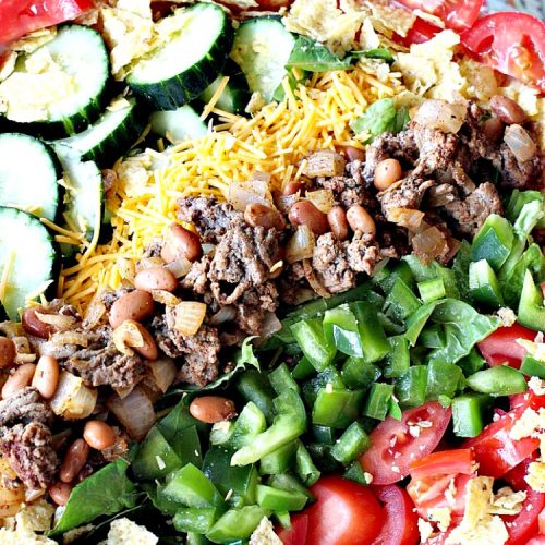 Mexican Taco Salad | Can't Stay Out of the Kitchen | dynamite #TexMex #salad with spicy #groundbeef, #pintobeans, #cheese & tortilla chips. Great for summer potlucks. #glutenfree