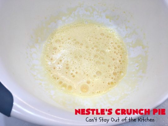 Nestle's Crunch Pie | Can't Stay Out of the Kitchen | this spectacular #pie is filled with #NestlesCrunchBars! It has that smooth milk #chocolate taste with a little crunch added to make it special. Every bite is a chocolaty delight. Terrific for company, #holidays like #ValentinesDay or special occasions. #Nestles #dessert #HolidayDessert #ChocolateDessert #NestlesCrunchPie