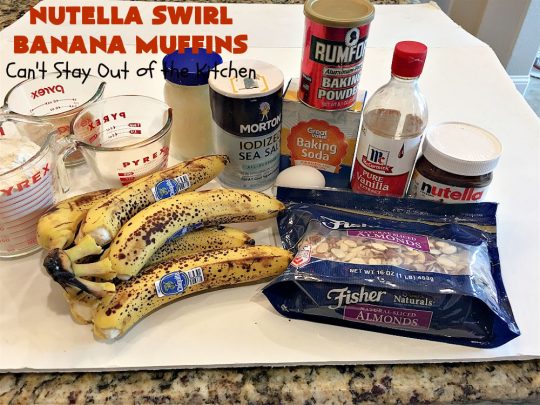 Nutella Swirl Banana Muffins | Can't Stay Out of the Kitchen | these outrageous #muffins are filled with #almonds & #bananas and swirled with #Nutella! These are so heavenly you won't be able to stay out of them. #breakfast #holiday #HolidayBreakfast #NutellaMuffins #NutellaSwirlBananaMuffins
