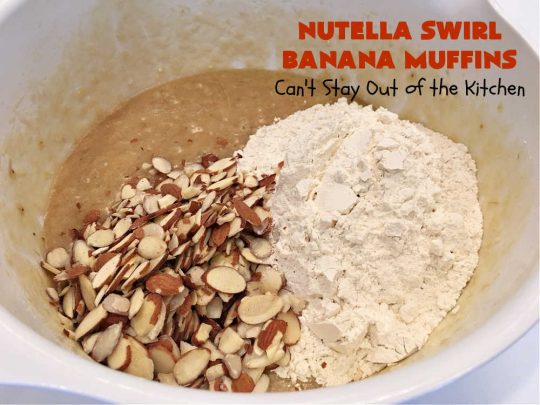 Nutella Swirl Banana Muffins | Can't Stay Out of the Kitchen | these outrageous #muffins are filled with #almonds & #bananas and swirled with #Nutella! These are so heavenly you won't be able to stay out of them. #breakfast #holiday #HolidayBreakfast #NutellaMuffins #NutellaSwirlBananaMuffins