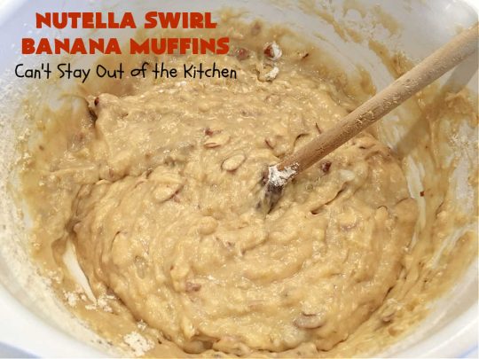 Nutella Swirl Banana Muffins | Can't Stay Out of the Kitchen | these outrageous #muffins are filled with #almonds & #bananas and swirled with #Nutella! These are so heavenly you won't be able to stay out of them. #breakfast #holiday #HolidayBreakfast #NutellaMuffins #NutellaSwirlBananaMuffins