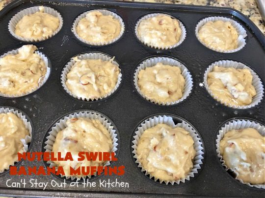 Nutella Swirl Banana Muffins | Can't Stay Out of the Kitchen | these outrageous #muffins are filled with #almonds & #bananas and swirled with #Nutella! These are so heavenly you won't be able to stay out of them. #breakfast #holiday #HolidayBreakfast #NutellaMuffins #NutellaSwirlBananaMuffins