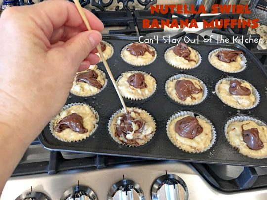 Nutella Swirl Banana Muffins | Can't Stay Out of the Kitchen | these outrageous #muffins are filled with #almonds & #bananas and swirled with #Nutella! These are so heavenly you won't be able to stay out of them. #breakfast #holiday #HolidayBreakfast #NutellaMuffins #NutellaSwirlBananaMuffins