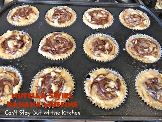 Nutella Swirl Banana Muffins | Can't Stay Out of the Kitchen | these outrageous #muffins are filled with #almonds & #bananas and swirled with #Nutella! These are so heavenly you won't be able to stay out of them. #breakfast #holiday #HolidayBreakfast #NutellaMuffins #NutellaSwirlBananaMuffins
