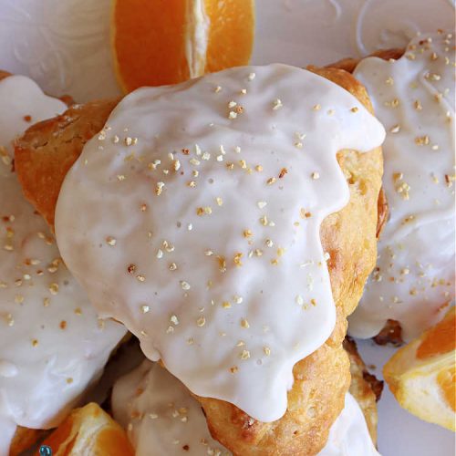 Orange Scones | Can't Stay Out of the Kitchen | these luscious #OrangeScones contain #OrangeJuice & #CandiedOrangePeel in the #scone & more #OJ & #OrangeZest in the icing. They're terrific for #holiday #breakfast or #brunch menus, including #Thanksgiving, #Christmas or #NewYearsDay or any day in between! Softer & sweeter than traditional scones, your family & friends will swoon over these. #orange #HolidayBreakfast #ParadiseFruit