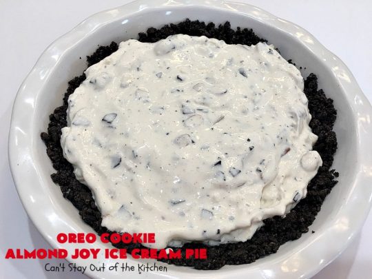 Oreo Cookie Almond Joy Ice Cream Pie | Can't Stay Out of the Kitchen | Wow your family and friends with this spectacular #IceCreamPie for #MothersDay! It combines the best of #Oreos with #AlmondJoyBars! Plus, it's a super easy 5-ingredient #dessert to die for! #Holiday #Pie #HolidayDessert #ChocolateDessert #OreoDessert #AlmondJoyDessert #ChocolatePie #OreoPie #IceCream #AlmondJoyPie #OreoCookieAlmondJoyIceCreamPie