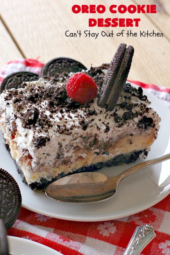 Oreo Cookie Dessert | Can't Stay Out of the Kitchen | This spectacular #dessert is rich, decadent & so addictive! No one will want only one piece! The bottom layer is crushed #Oreos. Layered with #BlueBell vanilla ice cream, then it has a homemade #fudge & walnut sauce. It's topped with #CoolWhip & more #Oreos. #OreoDessert #ChocolateDessert #IceCreamDessert #FudgeDessert #ValentinesDayDessert #HolidayDessert