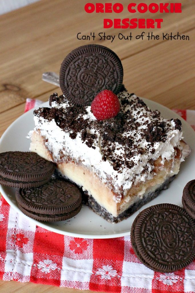 Oreo Cookie Dessert | Can't Stay Out of the Kitchen | This spectacular #dessert is rich, decadent & so addictive! No one will want only one piece! The bottom layer is crushed #Oreos. Layered with #BlueBell vanilla ice cream, then it has a homemade #fudge & walnut sauce. It's topped with #CoolWhip & more #Oreos. #OreoDessert #ChocolateDessert #IceCreamDessert #FudgeDessert #ValentinesDayDessert #HolidayDessert