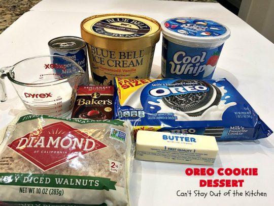 Oreo Cookie Dessert | Can't Stay Out of the Kitchen | This spectacular #dessert is rich, decadent & so addictive! No one will want only one piece! The bottom layer is crushed #Oreos. Layered with #BlueBell vanilla ice cream, then it has a homemade #fudge & walnut sauce. It's topped with #CoolWhip & more #Oreos. #OreoDessert #ChocolateDessert #IceCreamDessert #FudgeDessert #ValentinesDayDessert #HolidayDessert