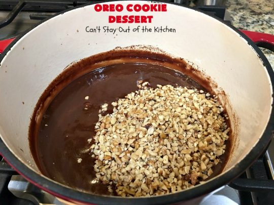 Oreo Cookie Dessert | Can't Stay Out of the Kitchen | This spectacular #dessert is rich, decadent & so addictive! No one will want only one piece! The bottom layer is crushed #Oreos. Layered with #BlueBell vanilla ice cream, then it has a homemade #fudge & walnut sauce. It's topped with #CoolWhip & more #Oreos. #OreoDessert #ChocolateDessert #IceCreamDessert #FudgeDessert #ValentinesDayDessert #HolidayDessert
