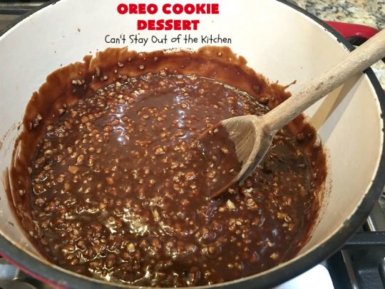 Oreo Cookie Dessert | Can't Stay Out of the Kitchen | This spectacular #dessert is rich, decadent & so addictive! No one will want only one piece! The bottom layer is crushed #Oreos. Layered with #BlueBell vanilla ice cream, then it has a homemade #fudge & walnut sauce. It's topped with #CoolWhip & more #Oreos. #OreoDessert #ChocolateDessert #IceCreamDessert #FudgeDessert #ValentinesDayDessert #HolidayDessert