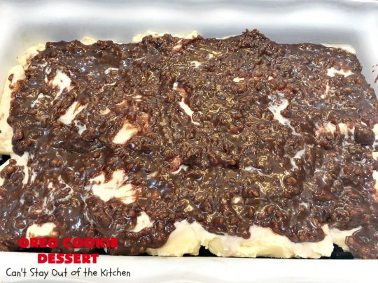 Oreo Cookie Dessert | Can't Stay Out of the Kitchen | This spectacular #dessert is rich, decadent & so addictive! No one will want only one piece! The bottom layer is crushed #Oreos. Layered with #BlueBell vanilla ice cream, then it has a homemade #fudge & walnut sauce. It's topped with #CoolWhip & more #Oreos. #OreoDessert #ChocolateDessert #IceCreamDessert #FudgeDessert #ValentinesDayDessert #HolidayDessert