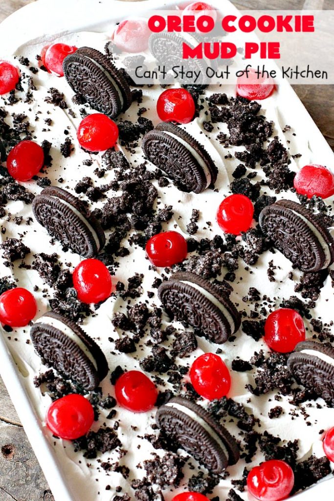 Oreo Cookie Mud Pie | Can't Stay Out of the Kitchen | this spectacular layered #dessert has an #Oreo crust, a #cheesecake layer, a #chocolate #pudding layer, and a #CoolWhip layer with #maraschinocherries. This amazing dessert is always raved over whenever I make it! #chocolatedessert #OreoDessert