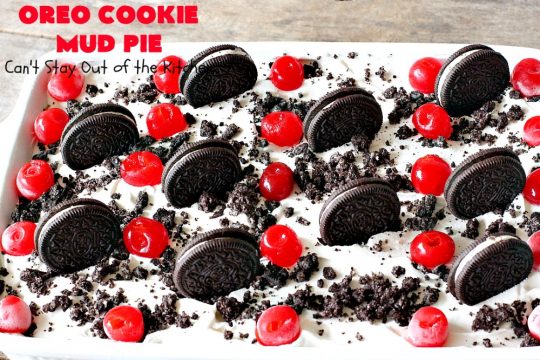 Oreo Cookie Mud Pie | Can't Stay Out of the Kitchen | this spectacular layered #dessert has an #Oreo crust, a #cheesecake layer, a #chocolate #pudding layer, and a #CoolWhip layer with #maraschinocherries. This amazing dessert is always raved over whenever I make it! #chocolatedessert #OreoDessert