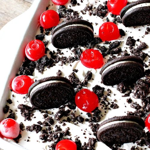Oreo Cookie Mud Pie | Can't Stay Out of the Kitchen | this spectacular layered #dessert has an #Oreo crust, a #cheesecake layer, a #chocolate #pudding layer, and a #CoolWhip layer with #maraschinocherries. This amazing dessert is always raved over whenever I make it! #chocolatedessert #OreoDessert