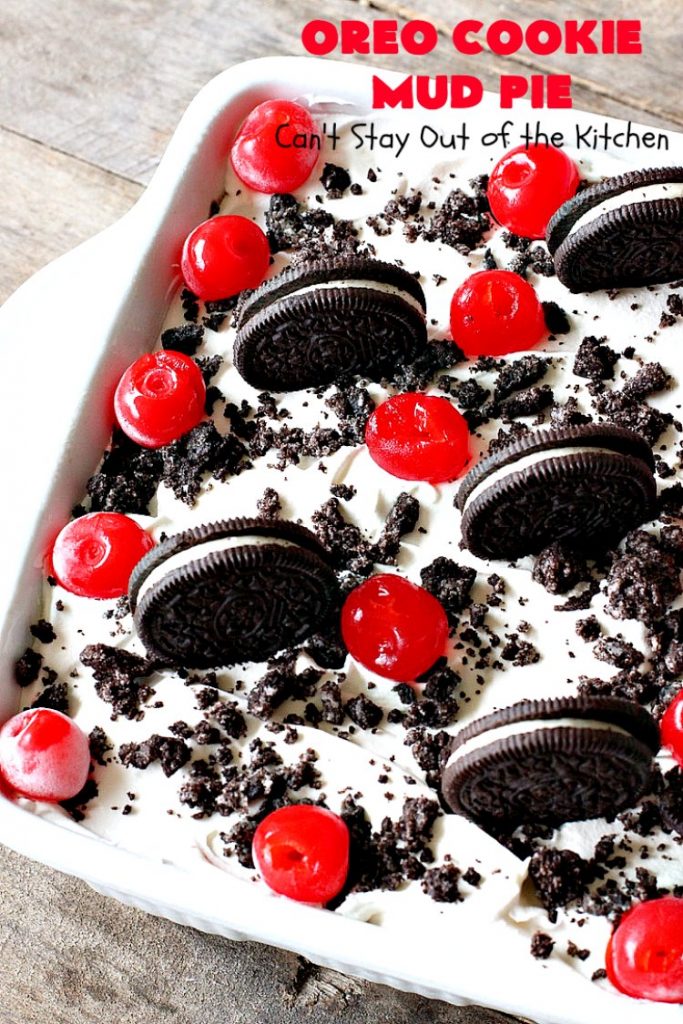 Oreo Cookie Mud Pie | Can't Stay Out of the Kitchen | this spectacular layered #dessert has an #Oreo crust, a #cheesecake layer, a #chocolate #pudding layer, and a #CoolWhip layer with #maraschinocherries. This amazing dessert is always raved over whenever I make it! #chocolatedessert #OreoDessert