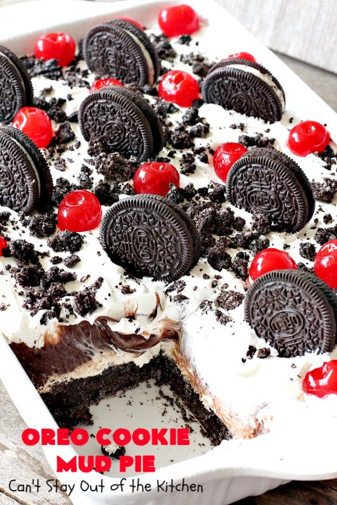 Oreo Cookie Mud Pie | Can't Stay Out of the Kitchen | this spectacular layered #dessert has an #Oreo crust, a #cheesecake layer, a #chocolate #pudding layer, and a #CoolWhip layer with #maraschinocherries. This amazing dessert is always raved over whenever I make it! #chocolatedessert #OreoDessert