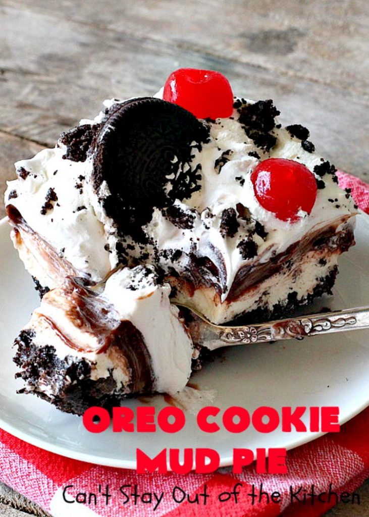 Oreo Cookie Mud Pie | Can't Stay Out of the Kitchen | this spectacular layered #dessert has an #Oreo crust, a #cheesecake layer, a #chocolate #pudding layer, and a #CoolWhip layer with #maraschinocherries. This amazing dessert is always raved over whenever I make it! #chocolatedessert #OreoDessert
