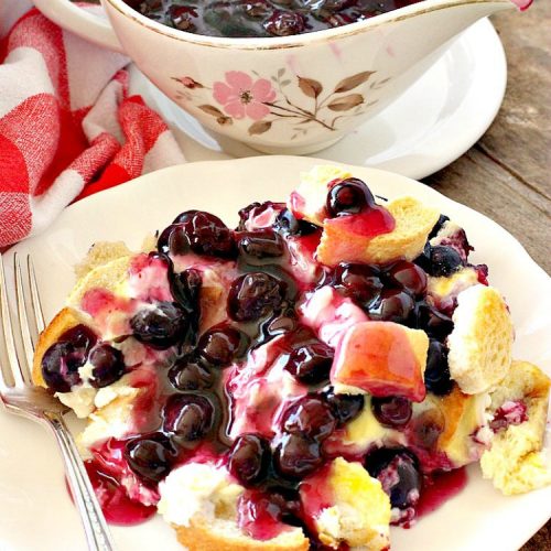 Overnight Blueberry French Toast | Can't Stay Out of the Kitchen | this amazing #FrenchToast is the most awesome decadent #breakfast #casserole you'll ever eat. It's loaded with #blueberries & cream cheese & served with homemade #blueberry sauce. Perfect for #MothersDay, #FathersDay or other #holiday breakfasts.