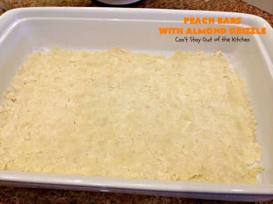 Peach Bars with Almond Drizzle | Can't Stay Out of the Kitchen | this heavenly #dessert uses fresh #peaches, has a streusel topping & glazed with #almond icing. Perfect #dessert for #LaborDay or other summer holidays. 