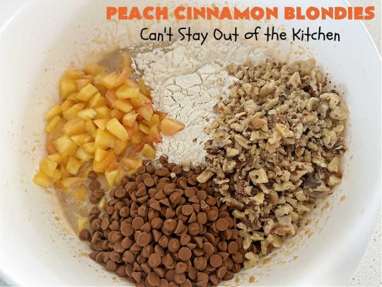 Peach Cinnamon Blondies | Can't Stay Out of the Kitchen | these rich, decadent #blondies will have you drooling from the first bite! They're made with fresh #peaches, #walnuts, #cinnamon & #CinnamonChips. These #cookies contain browned butter in the bar and the icing so they're incredibly delicious. Terrific for #tailgating, potlucks or backyard BBQs. #dessert #PeachDessert #PeachCinnamonBlondies