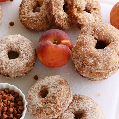 Peach Cinnamon Donuts | Can't Stay Out of the Kitchen | these scrumptious #donuts are so rich & decadent it's like eating #dessert! They're filled with fresh #peaches, #cinnamon & #CinnamonChips & then dipped in a #CinnamonSugar mixture. Fabulous for a weekend, company or #holiday #breakfast. #HolidayBreakfast #PeachCinnamonDonuts