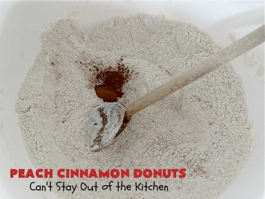 Peach Cinnamon Donuts | Can't Stay Out of the Kitchen | these scrumptious #donuts are so rich & decadent it's like eating #dessert! They're filled with fresh #peaches, #cinnamon & #CinnamonChips & then dipped in a #CinnamonSugar mixture. Fabulous for a weekend, company or #holiday #breakfast. #HolidayBreakfast #PeachCinnamonDonuts