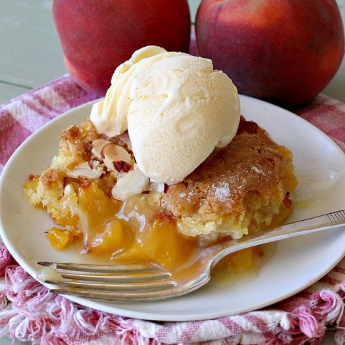 Peach Cobbler Amandine | Can't Stay Out of the Kitchen | this delightful #PeachCobbler #recipe uses #almonds, almond extract & almond meal to really bump up the flavors. It's a scrumptious #dessert to make with fresh #peaches. #PeachDessert #PeachCobblerAmandine #Canbassador #WashingtonStateFruitCommission #WashingtonStoneFruitGrowers #WashingtonStateStoneFruitGrowers