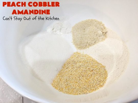 Peach Cobbler Amandine | Can't Stay Out of the Kitchen | this delightful #PeachCobbler #recipe uses #almonds, almond extract & almond meal to really bump up the flavors. It's a scrumptious #dessert to make with fresh #peaches. #PeachDessert #PeachCobblerAmandine #Canbassador #WashingtonStateFruitCommission #WashingtonStoneFruitGrowers #WashingtonStateStoneFruitGrowers