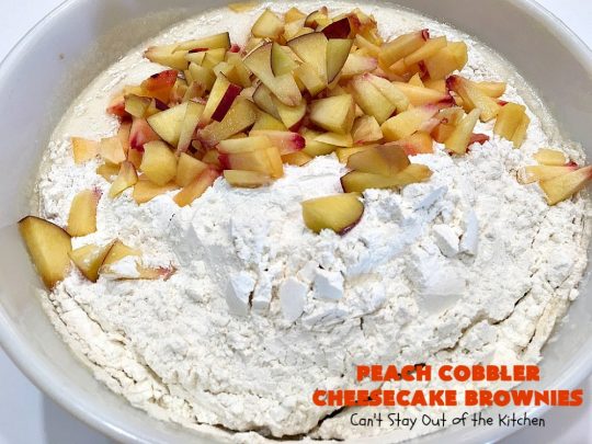 Peach Cobbler Cheesecake Brownies | Can't Stay Out of the Kitchen | these spectacular #brownies start with a #peachcobbler #cookie dough. They have a luscious #cheesecake filling in the middle, topped with fresh #peaches. Then more cookie dough is crumbled over top. These were a huge hit at my husband's office. #dessert #peachdessert #CANbassador #WashingtonStateFruitCommission #WashingtonStatestoneFruitGrowers