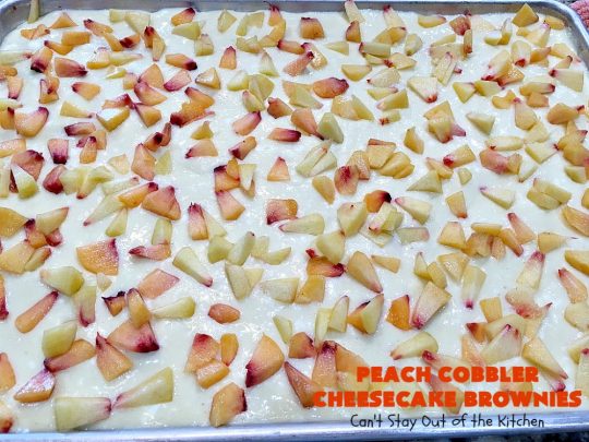 Peach Cobbler Cheesecake Brownies | Can't Stay Out of the Kitchen | these spectacular #brownies start with a #peachcobbler #cookie dough. They have a luscious #cheesecake filling in the middle, topped with fresh #peaches. Then more cookie dough is crumbled over top. These were a huge hit at my husband's office. #dessert #peachdessert #CANbassador #WashingtonStateFruitCommission #WashingtonStatestoneFruitGrowers