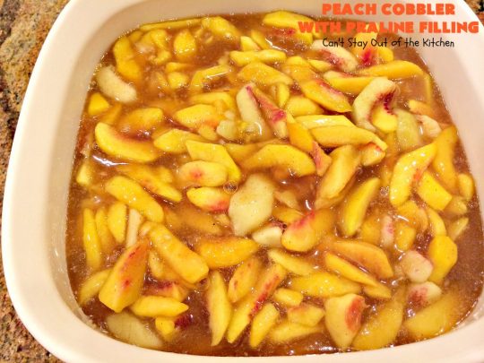 Peach Cobbler with Praline Filling | Can't Stay Out of the Kitchen | this luscious #peach #cobbler has #praline pie crust rolls on top. Absolutely divine! Perfect #dessert for summer.