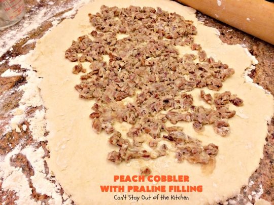 Peach Cobbler with Praline Filling | Can't Stay Out of the Kitchen | this luscious #peach #cobbler has #praline pie crust rolls on top. Absolutely divine! Perfect #dessert for summer.