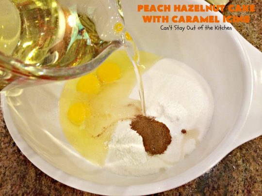 Peach Hazelnut Cake with Caramel Icing | Can't Stay Out of the Kitchen | in this fantastic #cake the #caramel icing sinks into the cake like a #pokecake. It's absolutely spectacular & the perfect #summer #dessert. #peaches #hazelnuts