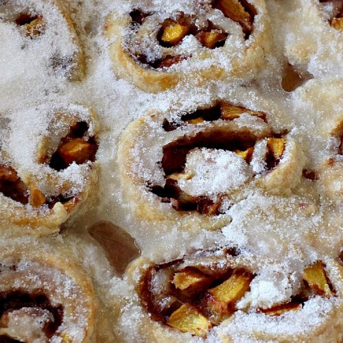 Peach Pinwheel Cobbler | Can't Stay Out of the Kitchen | this is one fantastic #PeachCobbler! #Peaches are wrapped up in dough pinwheel fashion. Syrup is poured over top before baking. The pinwheels absorb the syrup & puff up really large. This is absolutely heavenly. Wonderful #summer #dessert. #PeachDessert #cobbler #PeachPinwheelCobbler #Canbassador #WashingtonStateFruitCommission #WashingtonStoneFruitGrowers #WashingtonStateStoneFruitGrowers
