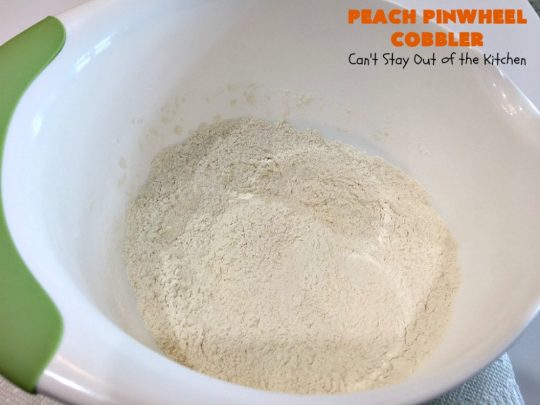 Peach Pinwheel Cobbler | Can't Stay Out of the Kitchen | this is one fantastic #PeachCobbler! #Peaches are wrapped up in dough pinwheel fashion. Syrup is poured over top before baking. The pinwheels absorb the syrup & puff up really large. This is absolutely heavenly. Wonderful #summer #dessert. #PeachDessert #cobbler #PeachPinwheelCobbler #Canbassador #WashingtonStateFruitCommission #WashingtonStoneFruitGrowers #WashingtonStateStoneFruitGrowers