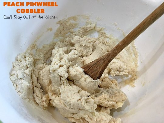 Peach Pinwheel Cobbler | Can't Stay Out of the Kitchen | this is one fantastic #PeachCobbler! #Peaches are wrapped up in dough pinwheel fashion. Syrup is poured over top before baking. The pinwheels absorb the syrup & puff up really large. This is absolutely heavenly. Wonderful #summer #dessert. #PeachDessert #cobbler #PeachPinwheelCobbler #Canbassador #WashingtonStateFruitCommission #WashingtonStoneFruitGrowers #WashingtonStateStoneFruitGrowers