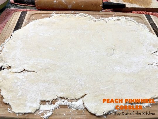 Peach Pinwheel Cobbler | Can't Stay Out of the Kitchen | this is one fantastic #PeachCobbler! #Peaches are wrapped up in dough pinwheel fashion. Syrup is poured over top before baking. The pinwheels absorb the syrup & puff up really large. This is absolutely heavenly. Wonderful #summer #dessert. #PeachDessert #cobbler #PeachPinwheelCobbler #Canbassador #WashingtonStateFruitCommission #WashingtonStoneFruitGrowers #WashingtonStateStoneFruitGrowers