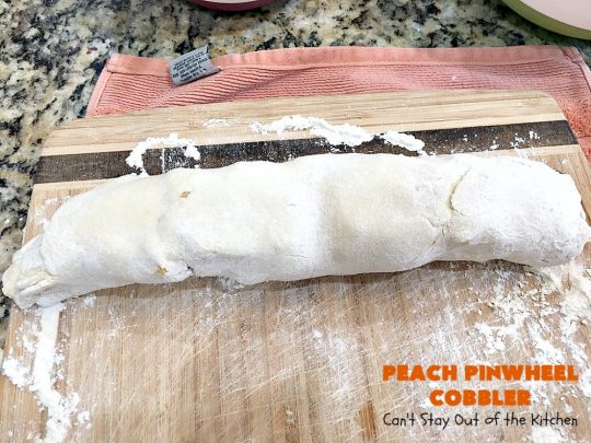 Peach Pinwheel Cobbler | Can't Stay Out of the Kitchen | this is one fantastic #PeachCobbler! #Peaches are wrapped up in dough pinwheel fashion. Syrup is poured over top before baking. The pinwheels absorb the syrup & puff up really large. This is absolutely heavenly. Wonderful #summer #dessert. #PeachDessert #cobbler #PeachPinwheelCobbler #Canbassador #WashingtonStateFruitCommission #WashingtonStoneFruitGrowers #WashingtonStateStoneFruitGrowers