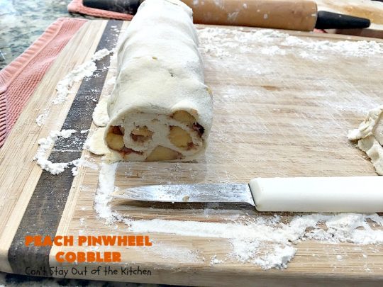 Peach Pinwheel Cobbler | Can't Stay Out of the Kitchen | this is one fantastic #PeachCobbler! #Peaches are wrapped up in dough pinwheel fashion. Syrup is poured over top before baking. The pinwheels absorb the syrup & puff up really large. This is absolutely heavenly. Wonderful #summer #dessert. #PeachDessert #cobbler #PeachPinwheelCobbler #Canbassador #WashingtonStateFruitCommission #WashingtonStoneFruitGrowers #WashingtonStateStoneFruitGrowers