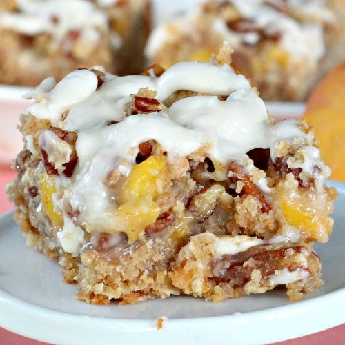 Peaches 'n Cream Bars | Can't Stay Out of the Kitchen | these fabulous #cookies have an #oatmeal #streusel crust, a #peach filling & they're glazed with vanilla icing. This is a terrific #dessert for summer #holidays like #FourthofJuly & #LaborDay when #peaches are in season. We loved them.