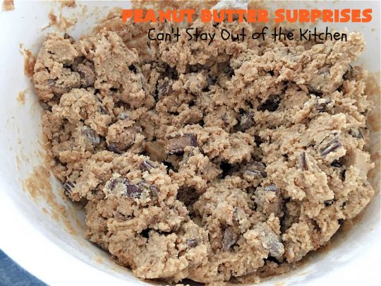 Peanut Butter Surprises | Can't Stay Out of the Kitchen | Surprise your family with these amazing #cookies. They're chocked full of #PeanutButter & #ReesesPeanutButterCups. Every bite will rock your world! Great for #tailgating or #holiday parties. #chocolate #dessert #ChocolateDessert #PeanutButterDessert #HolidayDessert #ReesesPeanutButterCupsDessert #PeanutButterSurprises