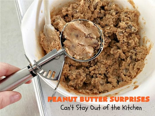 Peanut Butter Surprises | Can't Stay Out of the Kitchen | Surprise your family with these amazing #cookies. They're chocked full of #PeanutButter & #ReesesPeanutButterCups. Every bite will rock your world! Great for #tailgating or #holiday parties. #chocolate #dessert #ChocolateDessert #PeanutButterDessert #HolidayDessert #ReesesPeanutButterCupsDessert #PeanutButterSurprises