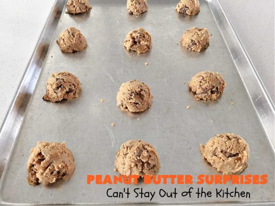 Peanut Butter Surprises | Can't Stay Out of the Kitchen | Surprise your family with these amazing #cookies. They're chocked full of #PeanutButter & #ReesesPeanutButterCups. Every bite will rock your world! Great for #tailgating or #holiday parties. #chocolate #dessert #ChocolateDessert #PeanutButterDessert #HolidayDessert #ReesesPeanutButterCupsDessert #PeanutButterSurprises