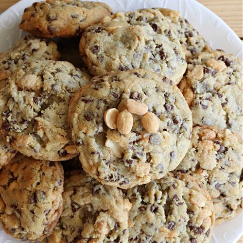 Peanutty Chocolate Chip Cookies | Can't Stay Out of the Kitchen | these luscious #cookies are filled with miniature #ChocolateChips & #RoastedPeanuts. They're both crunchy & chewy with soft insides. Excellent for #tailgating parties, potlucks, backyard BBQs & a #ChristmasCookieExchange. #holiday #HolidayDessert #ChocolateDessert #PeanutButterDessert #dessert #chocolate #PeanuttyChocolateChipCookies