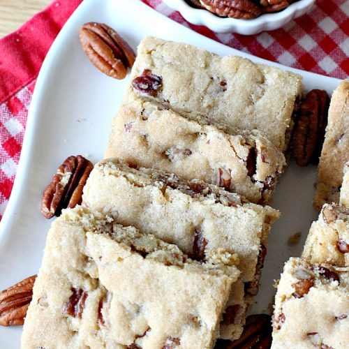 Pecan Bars | Can't Stay Out of the Kitchen | these delightful treats are absolutely dreamy. They'll cure any sweet tooth craving. If you enjoy #pecans you'll rave over this marvelous #cookie. #Holiday #dessert #PecanDessert #HolidayDessert #PecanPie #PecanBars #ChristmasCookieExchange #ValentinesDay