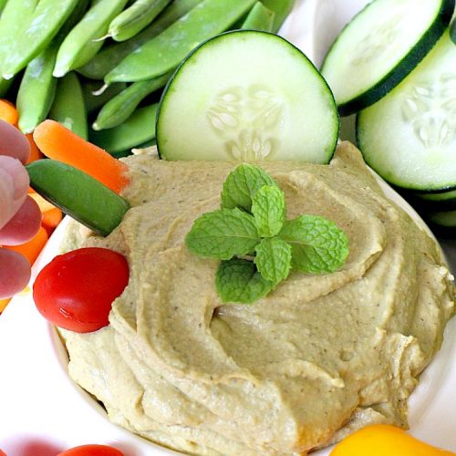 Pesto Hummus | Can't Stay Out of the Kitchen | this fantastic #hummus #recipe is filled with #pesto sauce, roasted #garlic & #garbanzobeans. It tastes so heavenly. It's a terrific #appetizer for company & great served with #veggie dippers. #LowCalorie #Healthy #GlutenFree #vegan #CleanEating