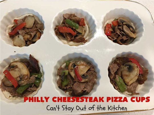 Philly Cheesesteak Pizza Cups | Can't Stay Out of the Kitchen | these fantastic #pizza cups are terrific for #tailgating parties, potlucks & even the #SuperBowl. If you enjoy miniature pizzas, you have to give this #PhillyCheesesteak version a try. This fantastic #appetizer will knock your socks off & will be enjoyed by your whole family! #SteakUmm #ProvoloneCheese #PhillyCheesesteakPizzaCups