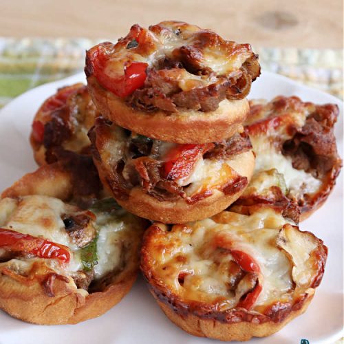 Philly Cheesesteak Pizza Cups | Can't Stay Out of the Kitchen | these fantastic #pizza cups are terrific for #tailgating parties, potlucks & even the #SuperBowl. If you enjoy miniature pizzas, you have to give this #PhillyCheesesteak version a try. This fantastic #appetizer will knock your socks off & will be enjoyed by your whole family! #SteakUmm #ProvoloneCheese #PhillyCheesesteakPizzaCups
